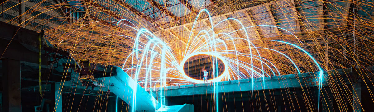 Factory with sparks Photo by Sean Pierce on Unsplash
